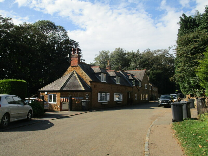 A row of ironstone cottages in the village on bin day