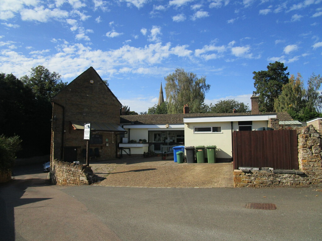 Thorpe Malsor Social Club, with the church spire behind